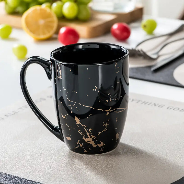 MarbellaGold | 16-Delig Zwart Porseleinen Servies met Gouden Marmerpatroon – Voor 4 Personen